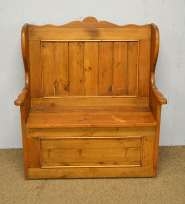 Lot 7 - A stained pine hall settle.