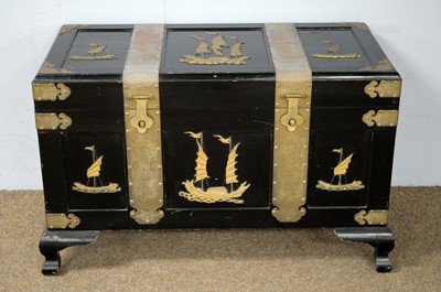 Lot 16 - A Chinese brass bound lacquered camphorwood blanket chest