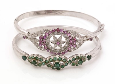 Lot 444 - Two gem set bangles.