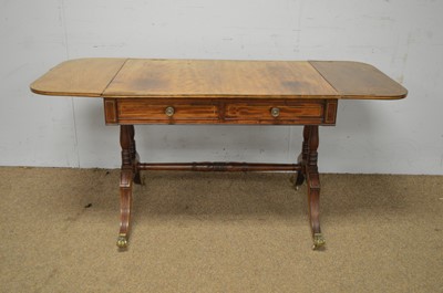Lot 36 - A Regency mahogany and brass inlaid sofa table.
