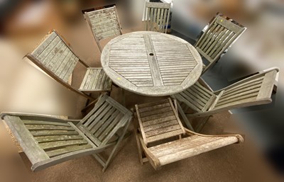 Lot 80 - Circular teak garden table; and seven garden chairs, various.