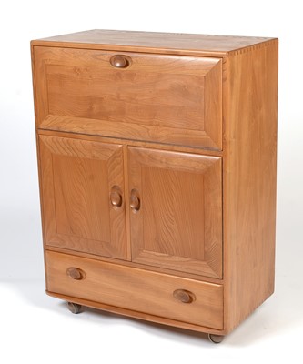Lot 372 - Ercol: An elm Windsor serving cabinet.
