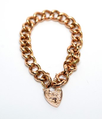 Lot 147 - A yellow metal curb link bracelet