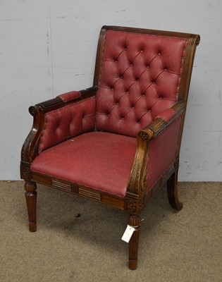 Lot 15 - A leaf carved and fluted Georgian-style buttoned-back armchair.