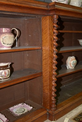 Lot 1091 - A large late Victorian walnut breakfront open bookcase