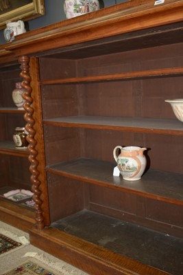 Lot 1091 - A large late Victorian walnut breakfront open bookcase