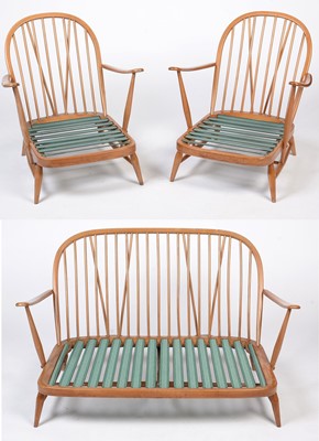 Lot 419 - Ercol: a beech Windsor bergere three piece suite, model 203.