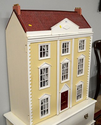 Lot 487 - A mid-20th Century three storey dolls house.
