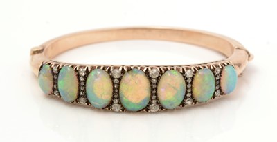 Lot 483 - A Victorian opal and diamond bangle