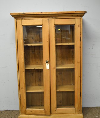Lot 82 - A 20th Century stripped pine bookcase.