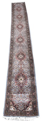 Lot 638 - A Tabriz runner