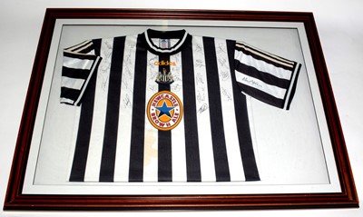 Lot 1186 - A Newcastle United replica football shirt, signed.