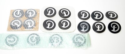 Lot 808 - A selection of Daimler car badges.