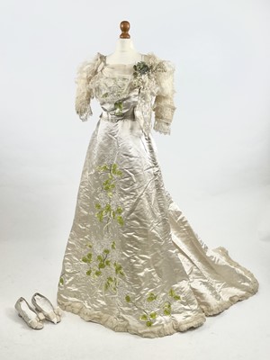 Lot 1199 - An uncommonly fine late Victorian champagne silk wedding ensemble by Heathcote and Co