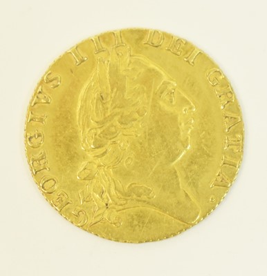 Lot 1032 - A George III spade guinea.