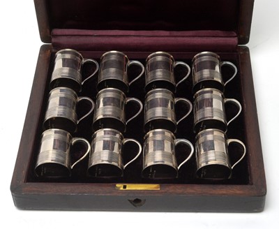 Lot 597 - A set of twelve Victorian silver miniature tankards