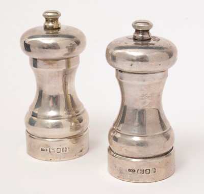 Lot 118 - A pair of silver pepper grinders, by David R Mills