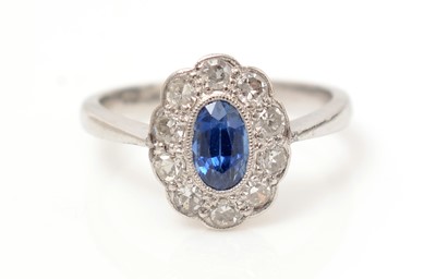 Lot 518 - A sapphire and diamond cluster ring