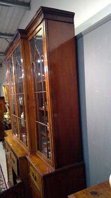 Lot 1299 - A large and impressive George III mahogany breakfront secretaire bookcase