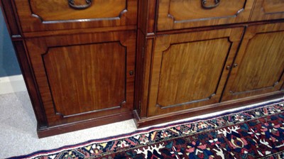 Lot 1299 - A large and impressive George III mahogany breakfront secretaire bookcase