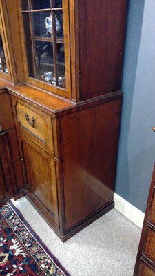 Lot 1299 - A large and impressive George III mahogany breakfront secretaire bookcase
