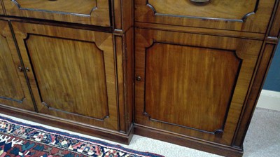 Lot 1299 - A large and impressive George III mahogany breakfront secretaire bookcase