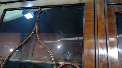 Lot 1299 - A large and impressive George III mahogany breakfront secretaire bookcase