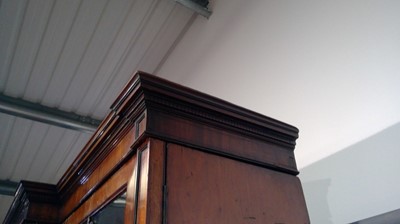 Lot 1299 - A large and impressive George III mahogany breakfront secretaire bookcase