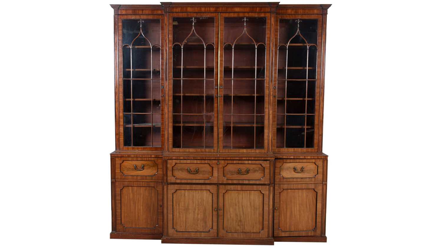Lot 1299 - A large and impressive George III mahogany breakfront secretaire bookcase