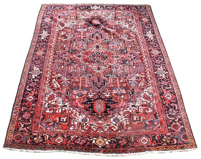 Lot 699 - A Heriz carpet