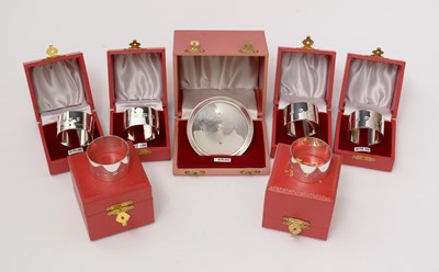 Lot 108 - Six silver napkin rings and a dish