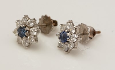 Lot 377 - A pair of sapphire and diamond cluster earrings