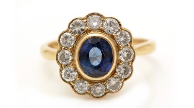 Lot 380 - A sapphire and diamond cluster ring