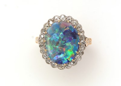 Lot 381 - An opal doublet and diamond cluster ring