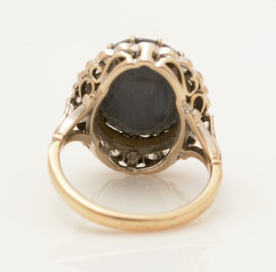 Lot 381 - An opal doublet and diamond cluster ring