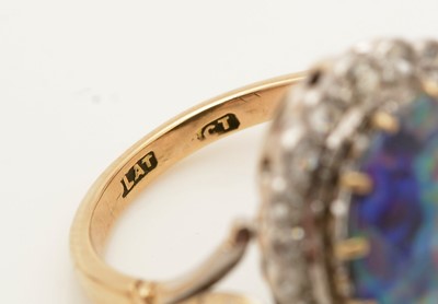 Lot 381 - An opal doublet and diamond cluster ring