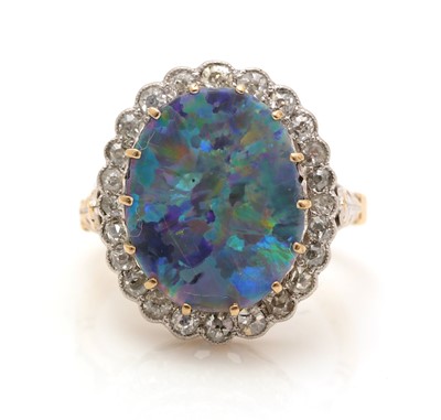 Lot 381 - An opal doublet and diamond cluster ring
