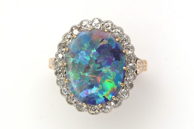 Lot 381 - An opal doublet and diamond cluster ring
