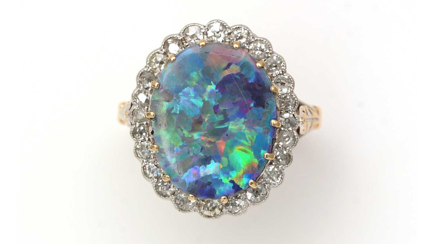 Lot 381 - An opal doublet and diamond cluster ring