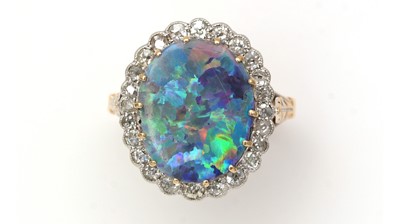 Lot 381 - An opal doublet and diamond cluster ring