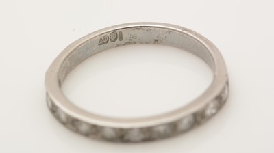 Lot 390 - A ten stone diamond half-hoop eternity ring