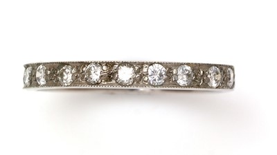 Lot 390 - A ten stone diamond half-hoop eternity ring