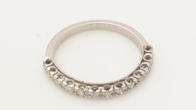 Lot 394 - A diamond half hoop eternity ring