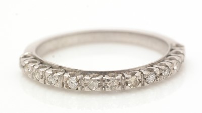 Lot 394 - A diamond half hoop eternity ring
