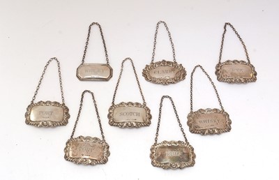Lot 122 - A selection of silver decanter labels