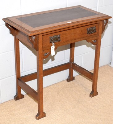 Lot 83 - An Arts & Crafts oak writing desk.