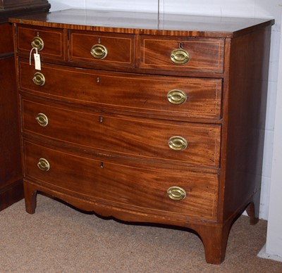 Lot 62 - A George III mahogany and line inlaid bowfront chest.