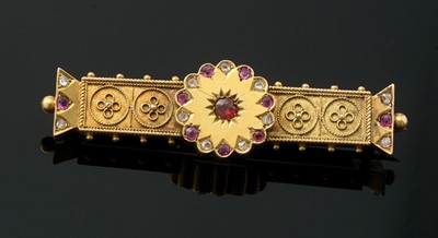 Lot 175 - A Victorian Etruscan revival ruby and diamond set gold brooch