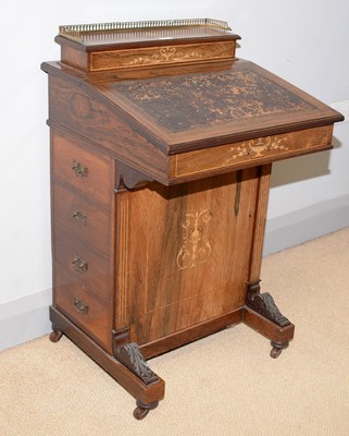 Lot 85 - A Victorian carved and inlaid rosewood Davenport.