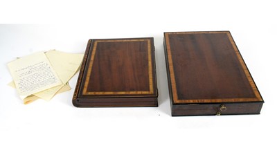 Lot 1244 - A collection of Grand Tour plaster intaglios ib book pattern cases